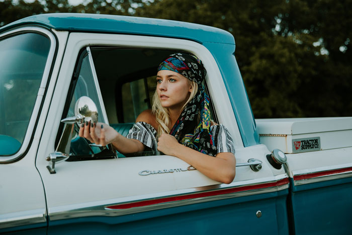 Woman driving a vintage car